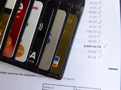 Wallet with credit cards and a credit card statement (bill)
